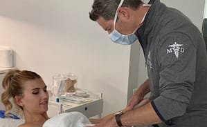 Dr. Brown with patient before skincare treatment