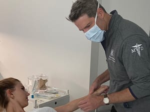 Dr. Brown with a patient before skincare treatment