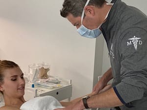 Dr. Brown with patient before skincare treatment