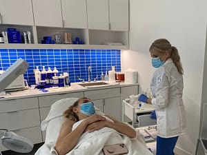 Jennifer getting ready to give a patient skincare treatment
