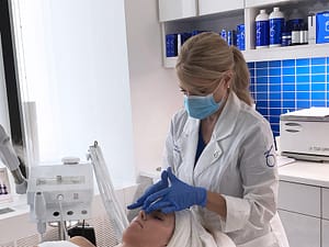 Jennifer performing skincare treatment
