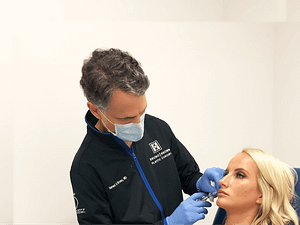 Dr. Bruno injecting lip filler