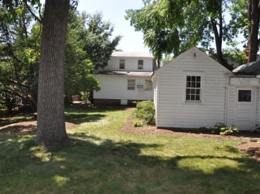 Tree removal after falling on garage in Maryland.