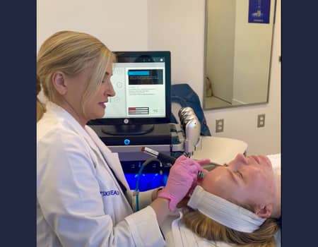 Skin care specialist preforming a HydraFacial